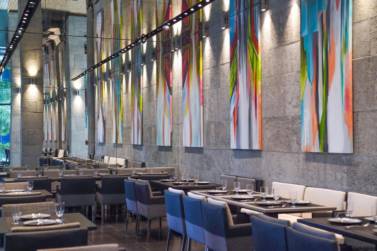 Hotel The St. Regis Ad Dawhah Esterno foto Restaurant interior